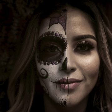 decorative image: woman with face paint for the day of the dead